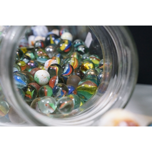 458 - Two glass jars of mixed vintage marbles in varying sizes