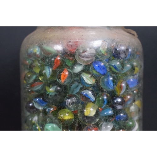 458 - Two glass jars of mixed vintage marbles in varying sizes