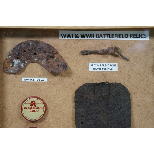 462 - Three framed sets of military items to include WW1 and WW2 battlefield relics and a selection of spa... 