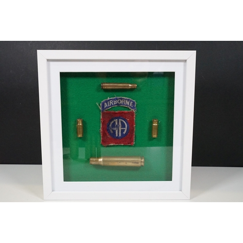 462 - Three framed sets of military items to include WW1 and WW2 battlefield relics and a selection of spa... 