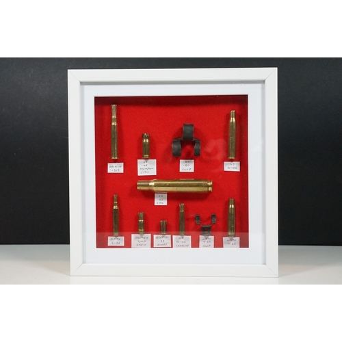 462 - Three framed sets of military items to include WW1 and WW2 battlefield relics and a selection of spa... 