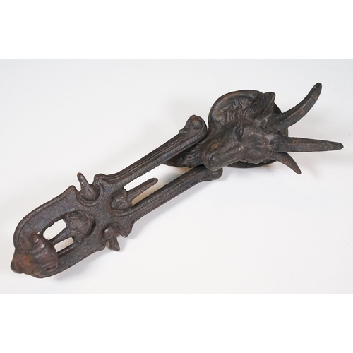 464 - Brass Art Nouveau door knocker together with others modelled as a grandfather clock, The cat and fid... 