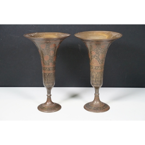 485 - Group of Indian style brass items to include goblets in varying sizes, cobra style candlesticks and ... 