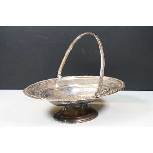 501 - Silver plated footed basket with handle together with a tall Egyptian copper plated cylindrical vase... 