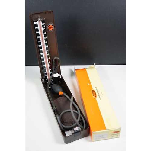 509 - Accoson Sphygmomanometer blood pressure machine in metal case together with an earlier wooden cased ... 