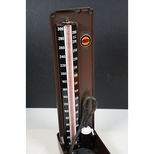 509 - Accoson Sphygmomanometer blood pressure machine in metal case together with an earlier wooden cased ... 