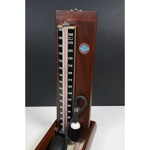 509 - Accoson Sphygmomanometer blood pressure machine in metal case together with an earlier wooden cased ... 