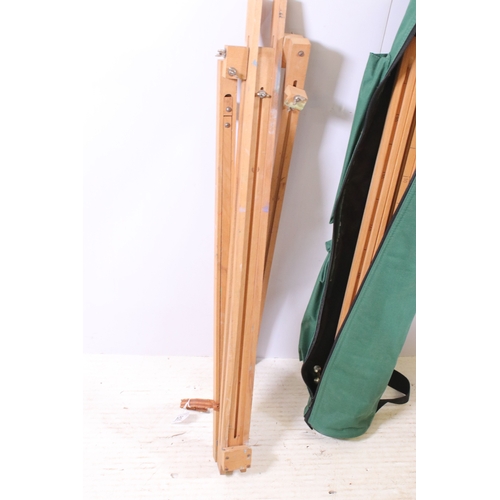 524 - Pair of wooden artists easels, one in carry bag