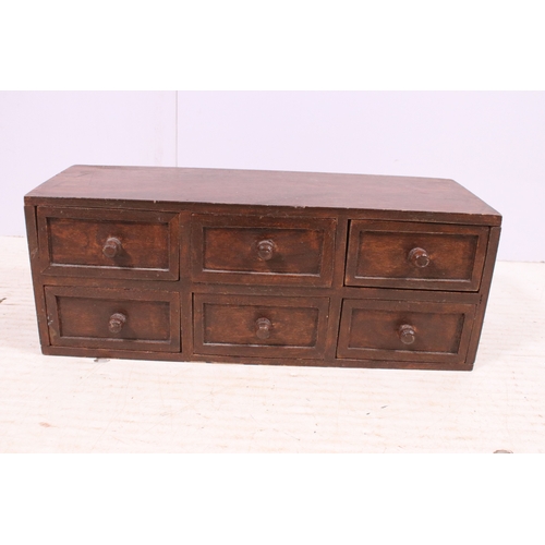 646 - Small mahogany table top bank of six drawers, H 15cm, W 40cm, D 14.5cm