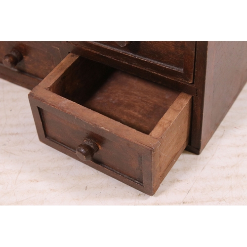 646 - Small mahogany table top bank of six drawers, H 15cm, W 40cm, D 14.5cm