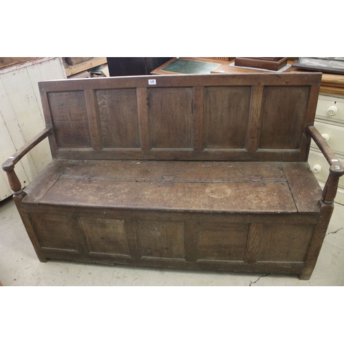 648 - Large antique oak monks bench settle with arms, H 92cm, W 152cm, D 49cm