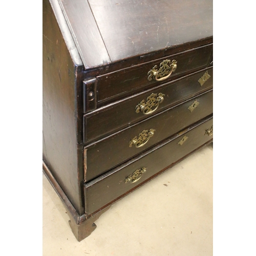 682 - Large oak writing bureau desk with two short and three long lower drawers (locked top) H 106cm, W 99... 