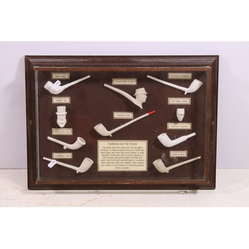 687 - Display case of various traditional clay pipe design examples together with an antique adjustable dr... 