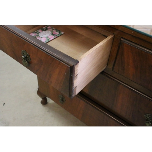 693 - 20th century veneer chest of drawers with glass top cover comprising of two short and three long low... 