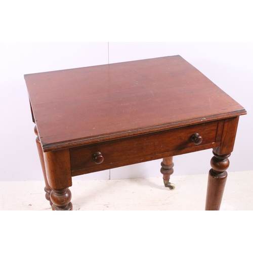 708 - Small single drawer mahogany table with turned legs and casters, H 75cm, W 67cm, D 53cm