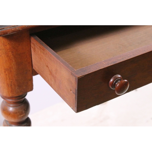 708 - Small single drawer mahogany table with turned legs and casters, H 75cm, W 67cm, D 53cm