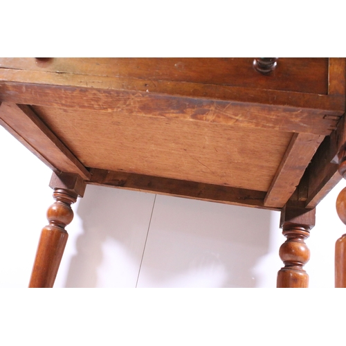 708 - Small single drawer mahogany table with turned legs and casters, H 75cm, W 67cm, D 53cm