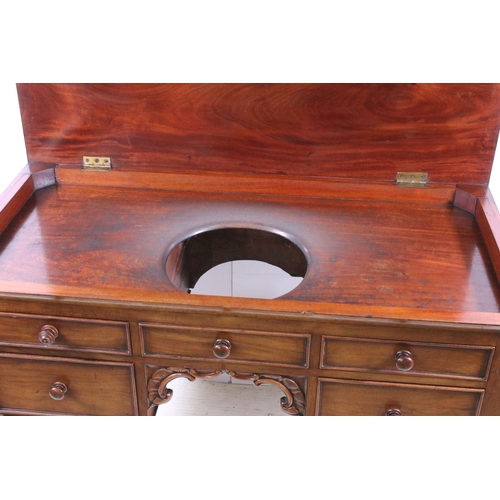 709 - 20th century mahogany dressing wash stand table on turned legs with central carved detail and five d... 