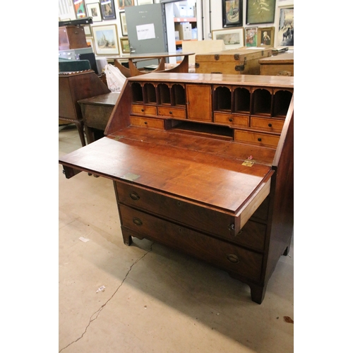 710 - Mahogany writing bureau with fold down front with fitted interior together with four lower long draw... 