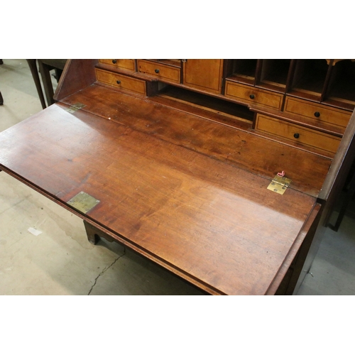 710 - Mahogany writing bureau with fold down front with fitted interior together with four lower long draw... 