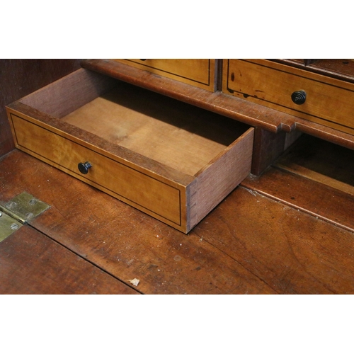 710 - Mahogany writing bureau with fold down front with fitted interior together with four lower long draw... 