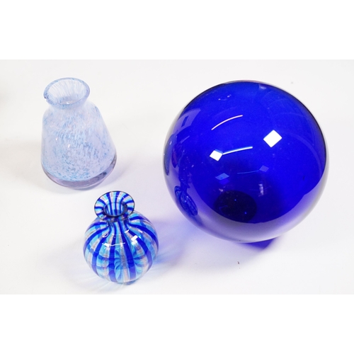 130 - Selection of mixed coloured glass to include Caithness dolphin vase, assorted paperweights, blue gla... 