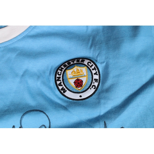 420 - Multi signed Manchester City 'Trinity' triple signed retro shirt by Francis Lee, Colin Bell and Mike... 