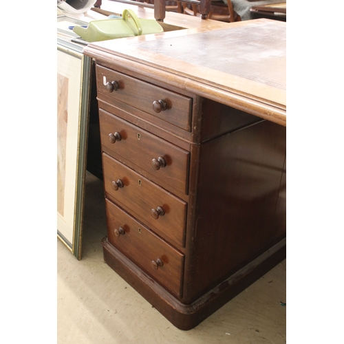 652 - Late 19th/ early 20th century large mahogany twin pedestal kneehole desk with eight drawers and inla... 