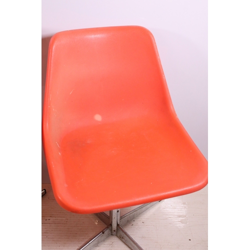 663 - Set of three 1960's Robin Day Design, orange Hille swivel chairs, raised on chrome supports, stamped... 