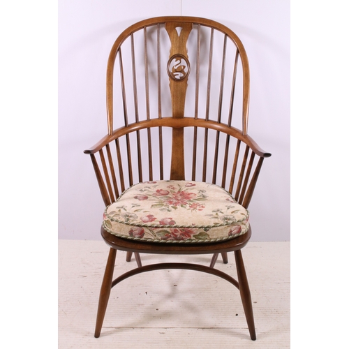 664 - Ercol spindle back Windsor armchair with pierced swan detail back, H 108cm