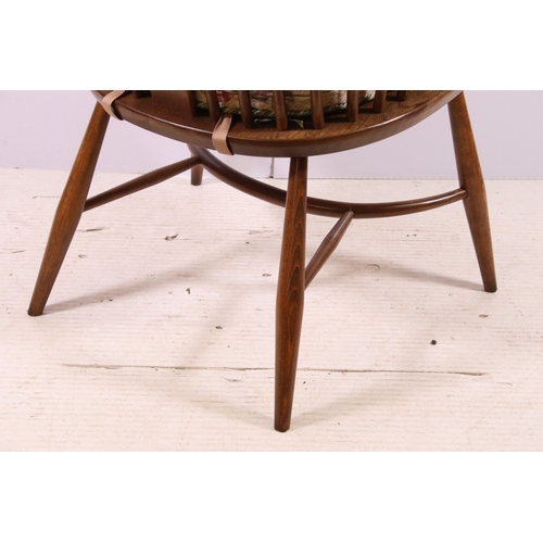 664 - Ercol spindle back Windsor armchair with pierced swan detail back, H 108cm