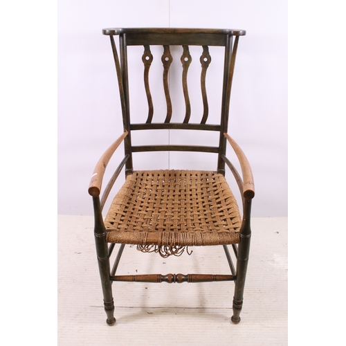 668 - Two Arts and Crafts slat back open arm chairs, curved back rail with four wavy pierced back splats a... 