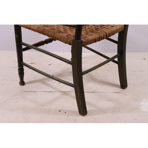 668 - Two Arts and Crafts slat back open arm chairs, curved back rail with four wavy pierced back splats a... 