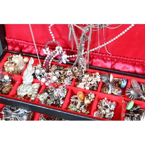 329 - A large collection of mixed vintage costume jewellery to include earrings, rings, necklace and brace... 