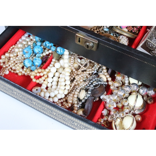 329 - A large collection of mixed vintage costume jewellery to include earrings, rings, necklace and brace... 