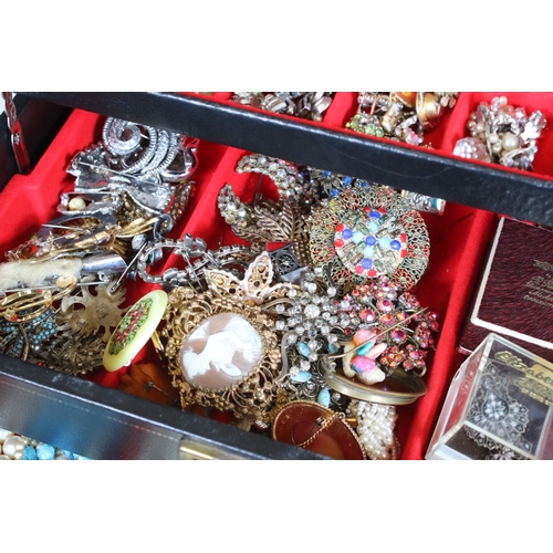 329 - A large collection of mixed vintage costume jewellery to include earrings, rings, necklace and brace... 