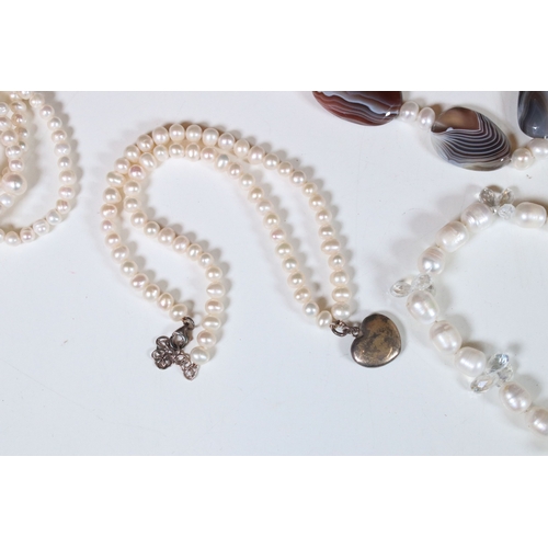 335 - Collection of pearl necklaces to include five cultured pearl examples and two simulated pearl neckla... 