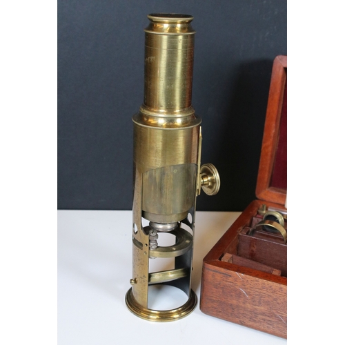 336 - A antique improved compound microscope within original fitted wooden case complete with accessories ... 