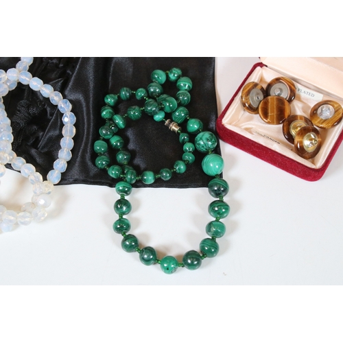 337 - A small quantity of costume jewellery to include a Malachite beaded necklace and a set of tigers eye... 