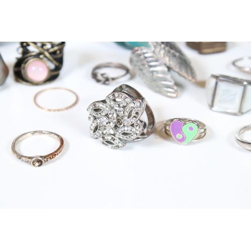 378 - A collection of costume jewellery rings within a glass paneled casket.