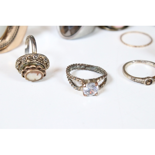 378 - A collection of costume jewellery rings within a glass paneled casket.