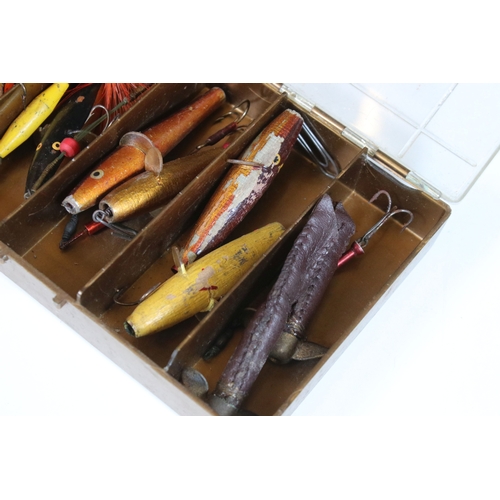 380 - A collection of vintage fishing lures within four boxes.