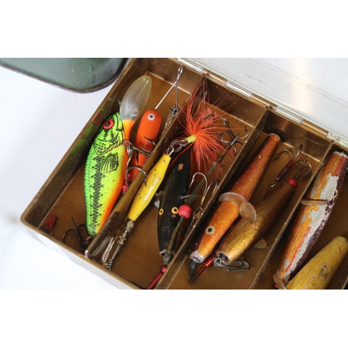 380 - A collection of vintage fishing lures within four boxes.