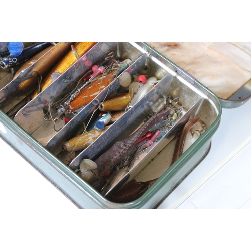 380 - A collection of vintage fishing lures within four boxes.