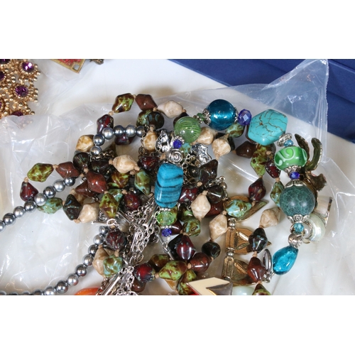 381 - A collection of mainly vintage costume jewellery to include necklaces, rings and brooches together w... 