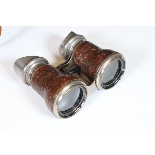 382 - Three pairs of vintage binoculars to include Prisma field binoculars together with optical collectab... 