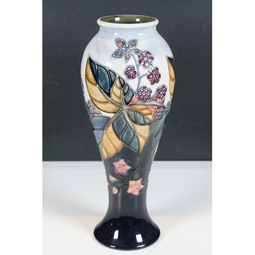 23 - Moorcroft 'Bramble' design baluster shaped vase, initialled and stamped to base H 28cm