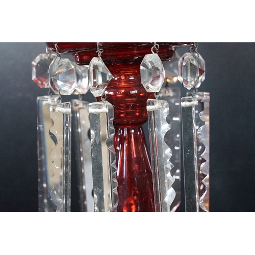 25 - Trio of antique cut glass lustres with prism droplets, two clear and one ruby glass example, tallest... 