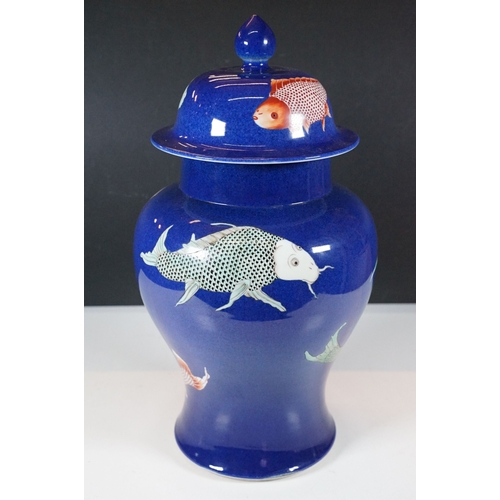 34 - Kangxi period powder blue lidded vase with carp fish pattern, baluster form with flared foot and str... 