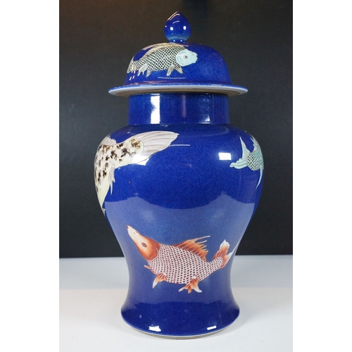 34 - Kangxi period powder blue lidded vase with carp fish pattern, baluster form with flared foot and str... 